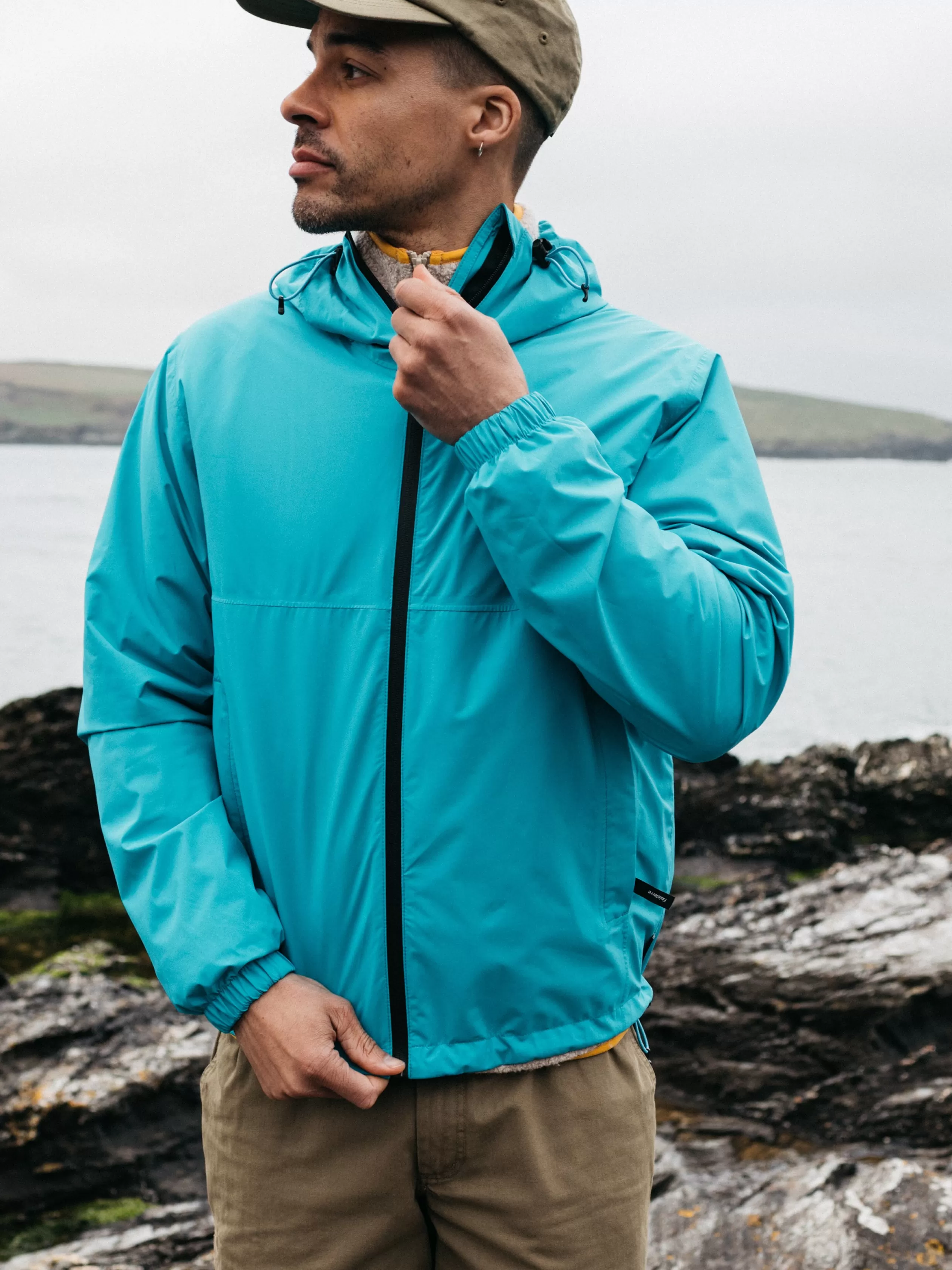 Finisterre Men's recycled lightweight waterproof jacket in < Jackets, Coats & Gilets