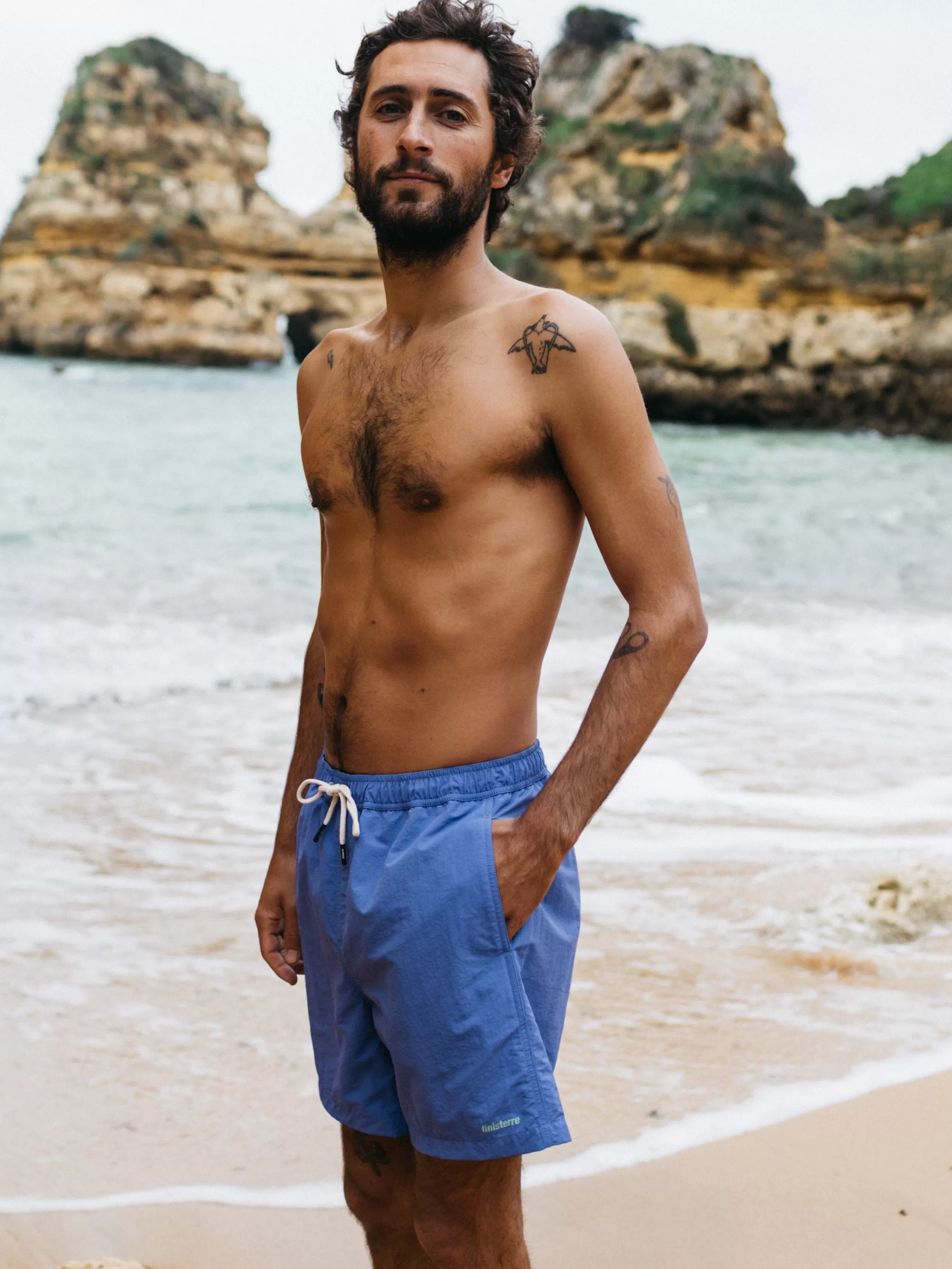 Finisterre Recycled swim shorts in amber orange< Swimwear